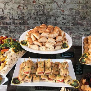 A table full of tea sandwiches for an event.