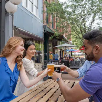 Group of young people toasting drinks in downtown Frankfort