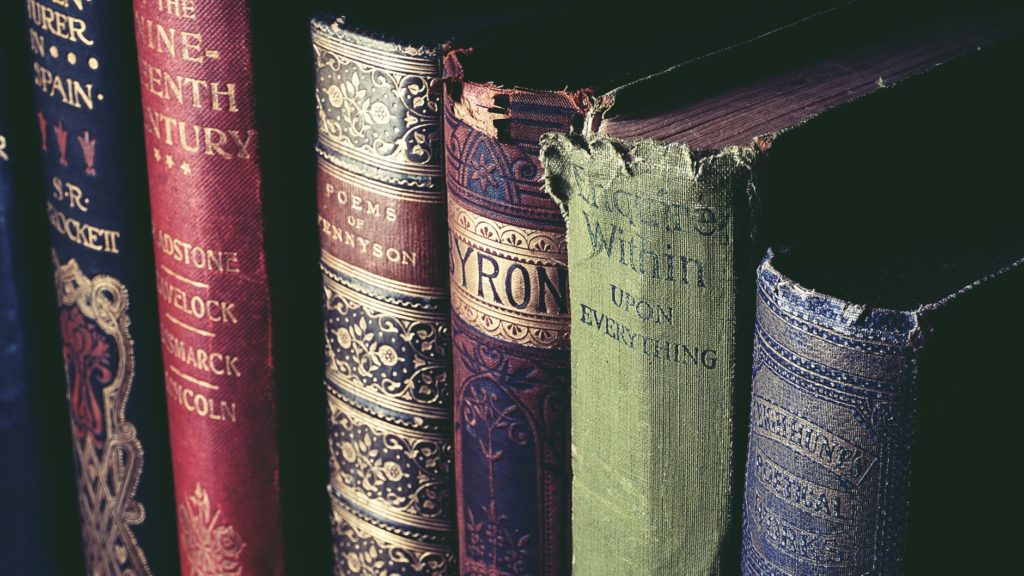 close-up image of 4 weathered books