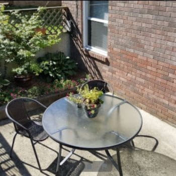 concrete patio with table and chairs