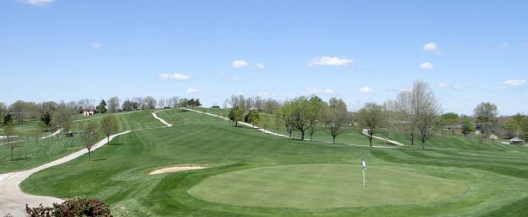 image of a green and fairway with a trail running along side.