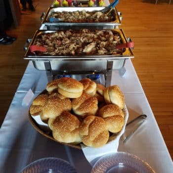 Staxx BBQ catering at an event. Pulled pork sandwiches